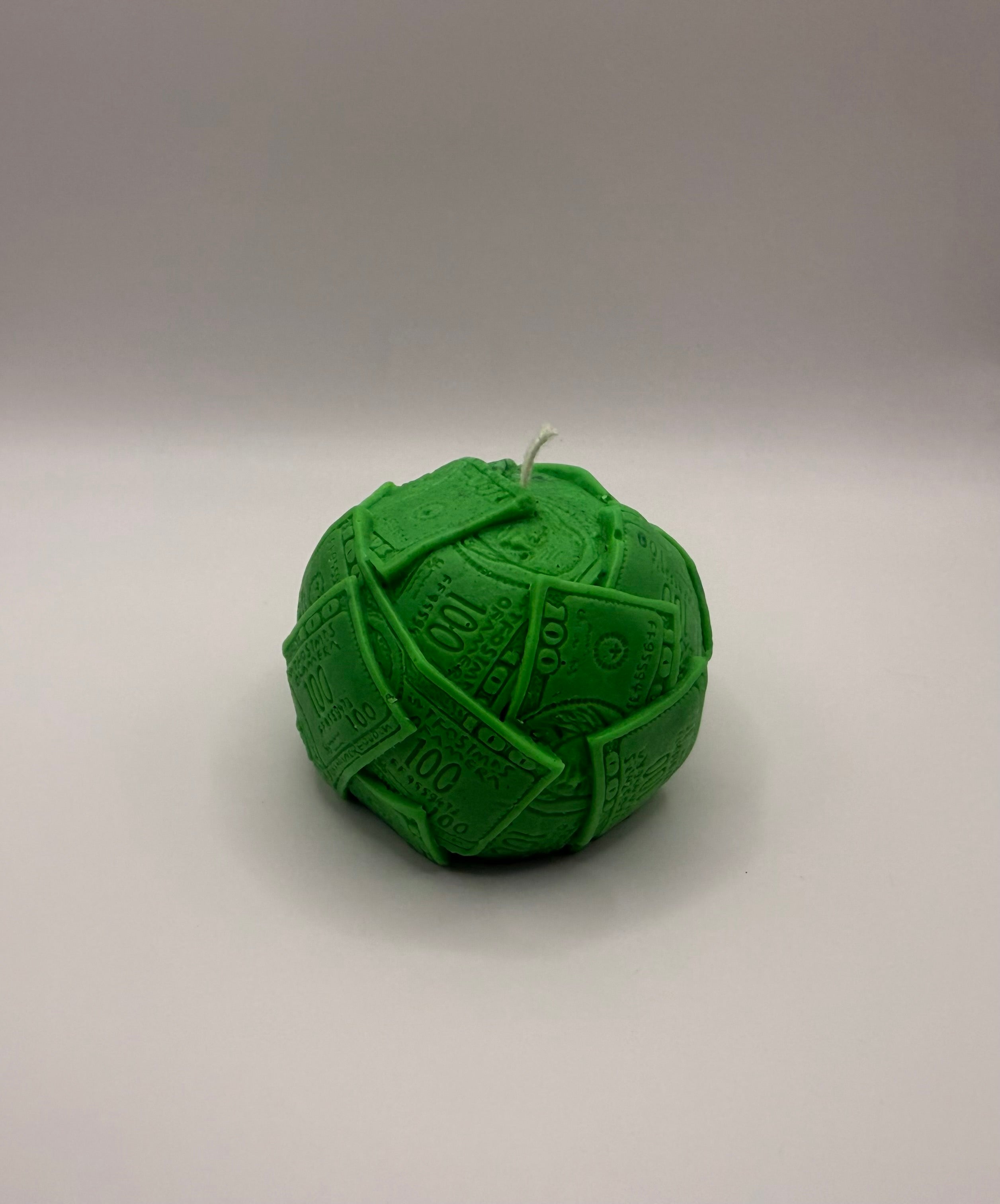 Ball of cash molded candle