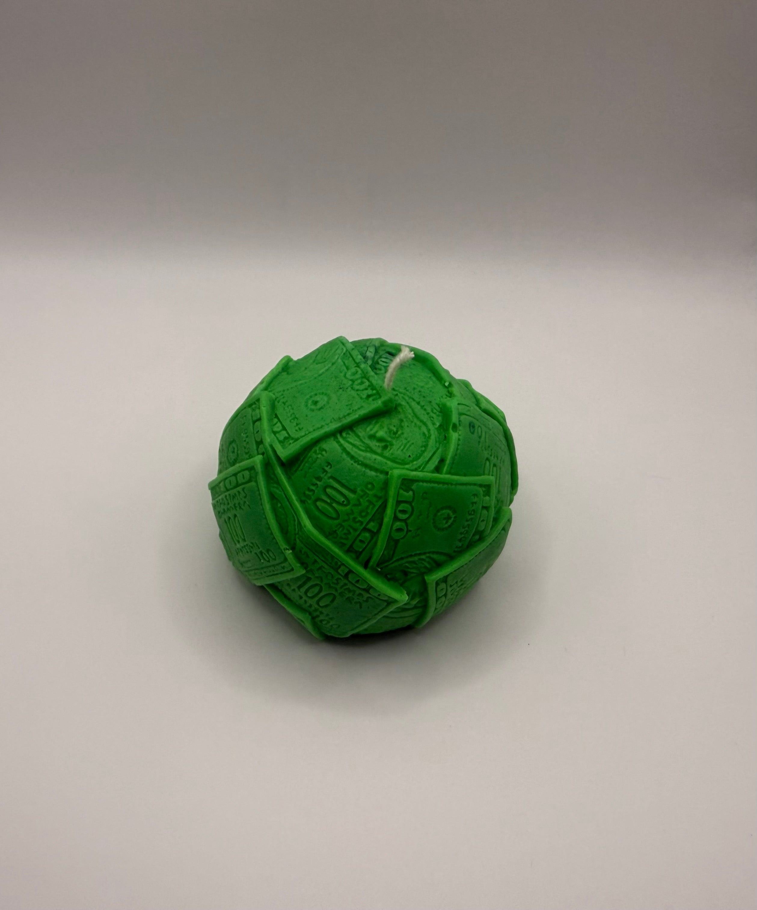 Ball of cash molded candle