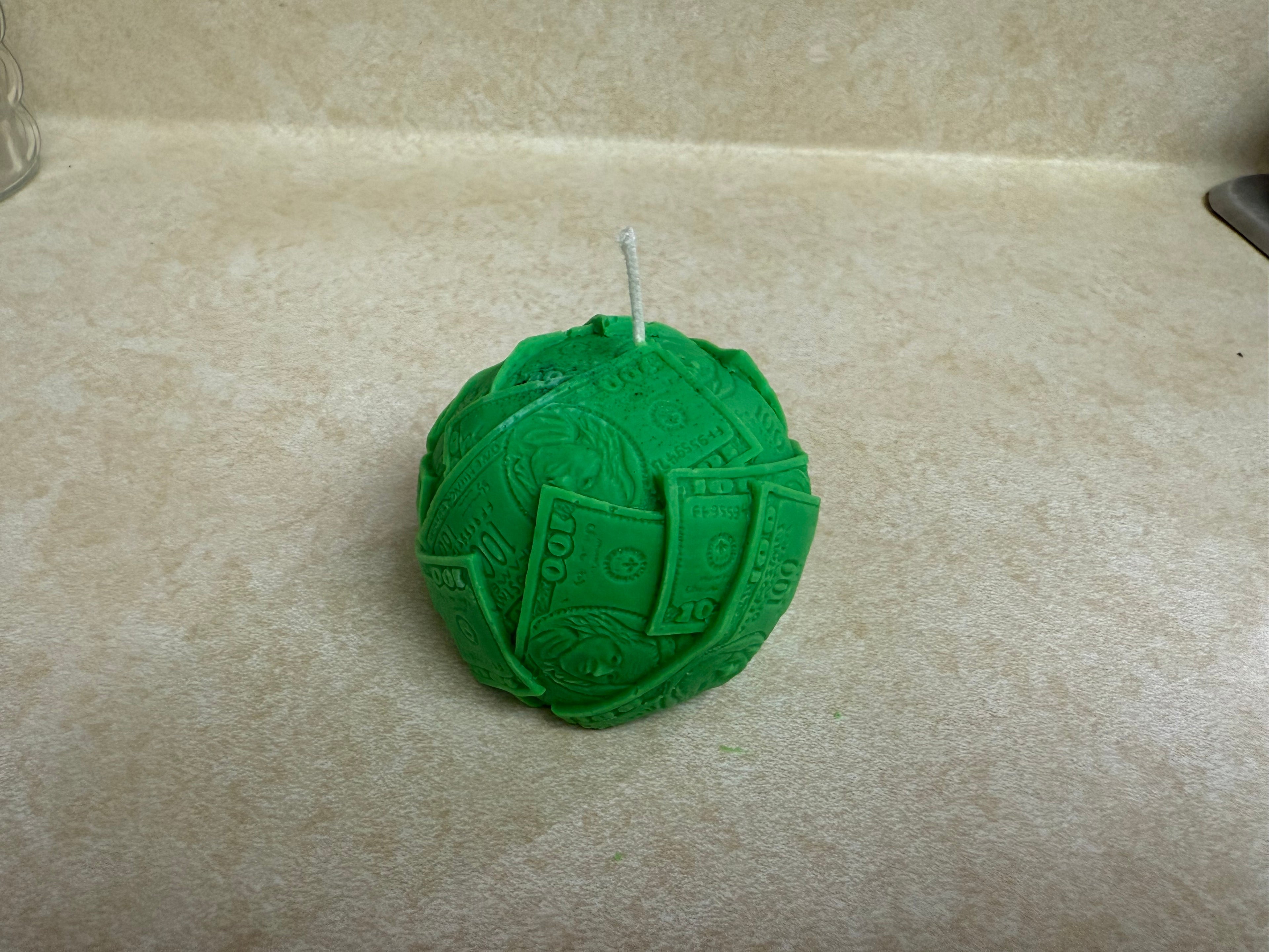 Ball of cash molded candle