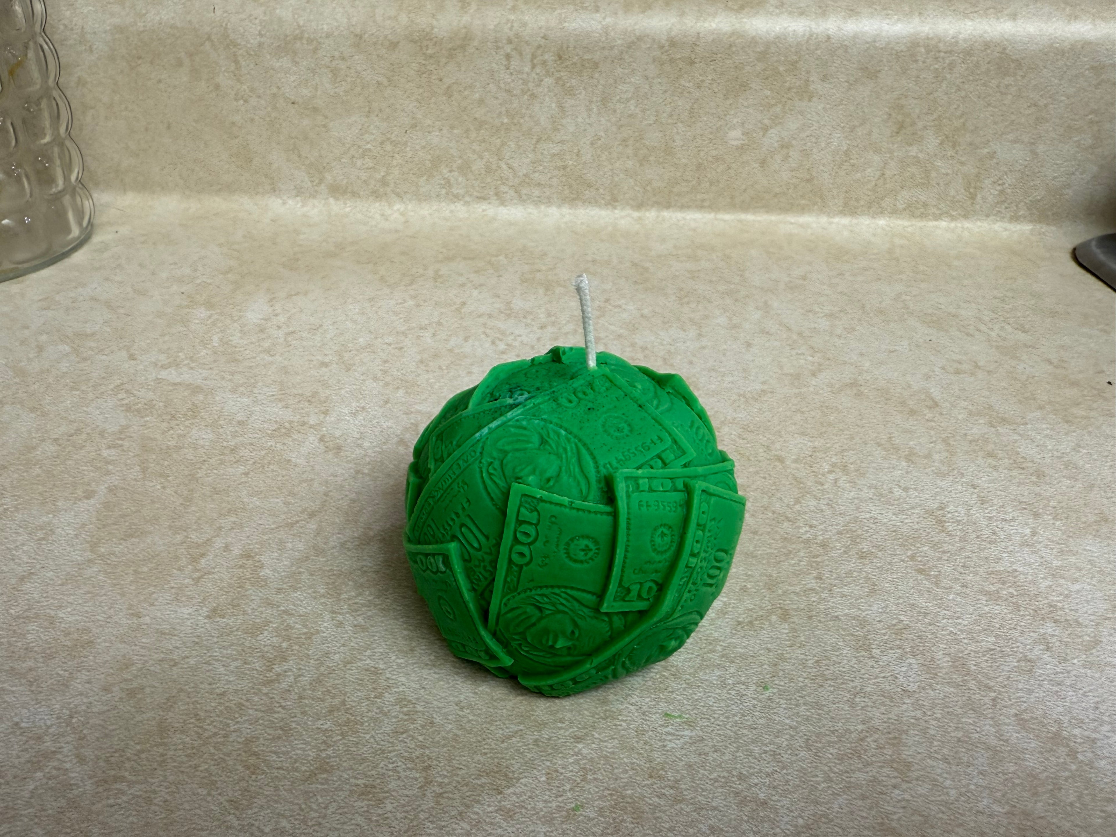 Ball of cash molded candle